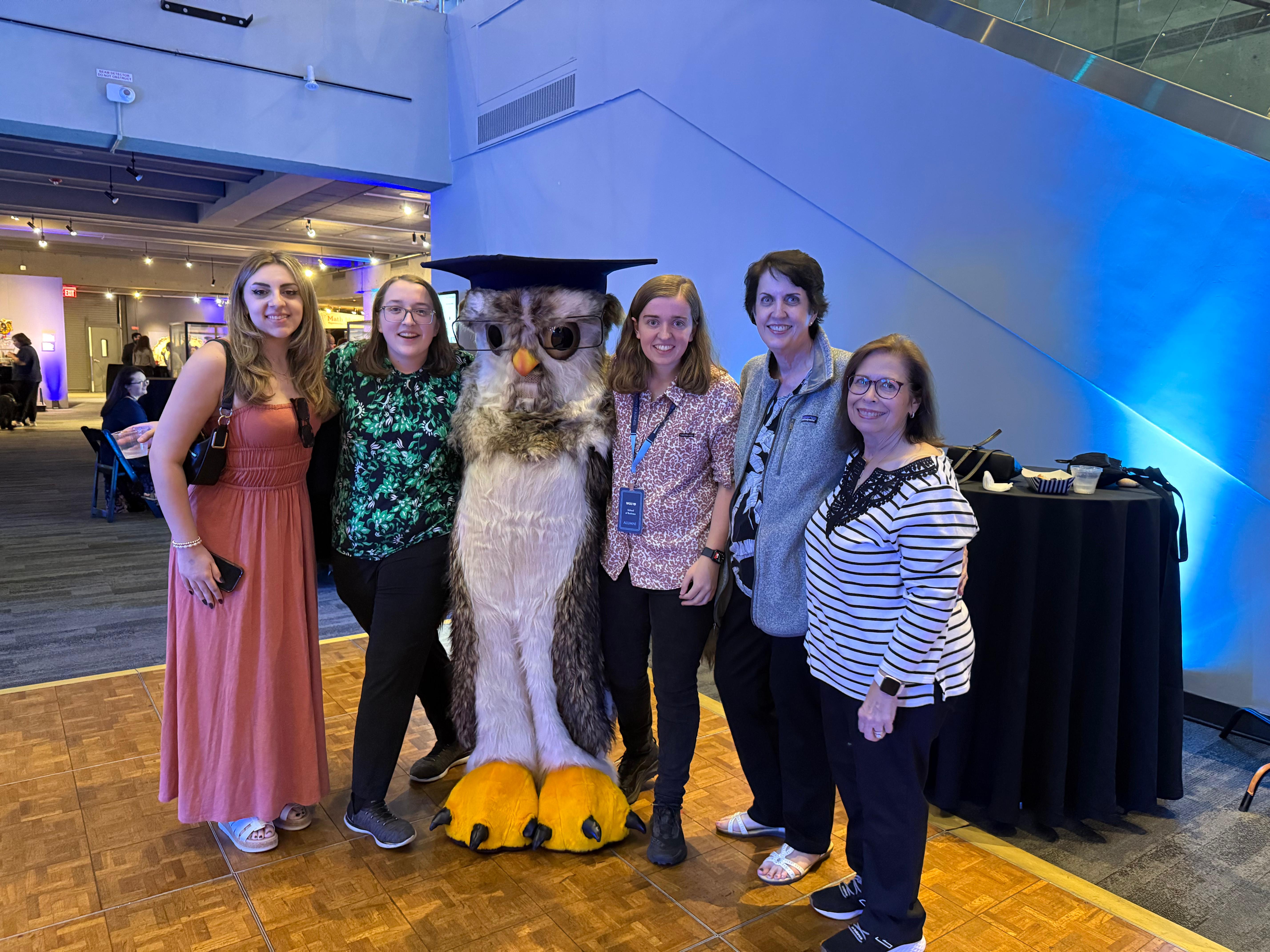 Rachel and her family in Boston with the college mascot
